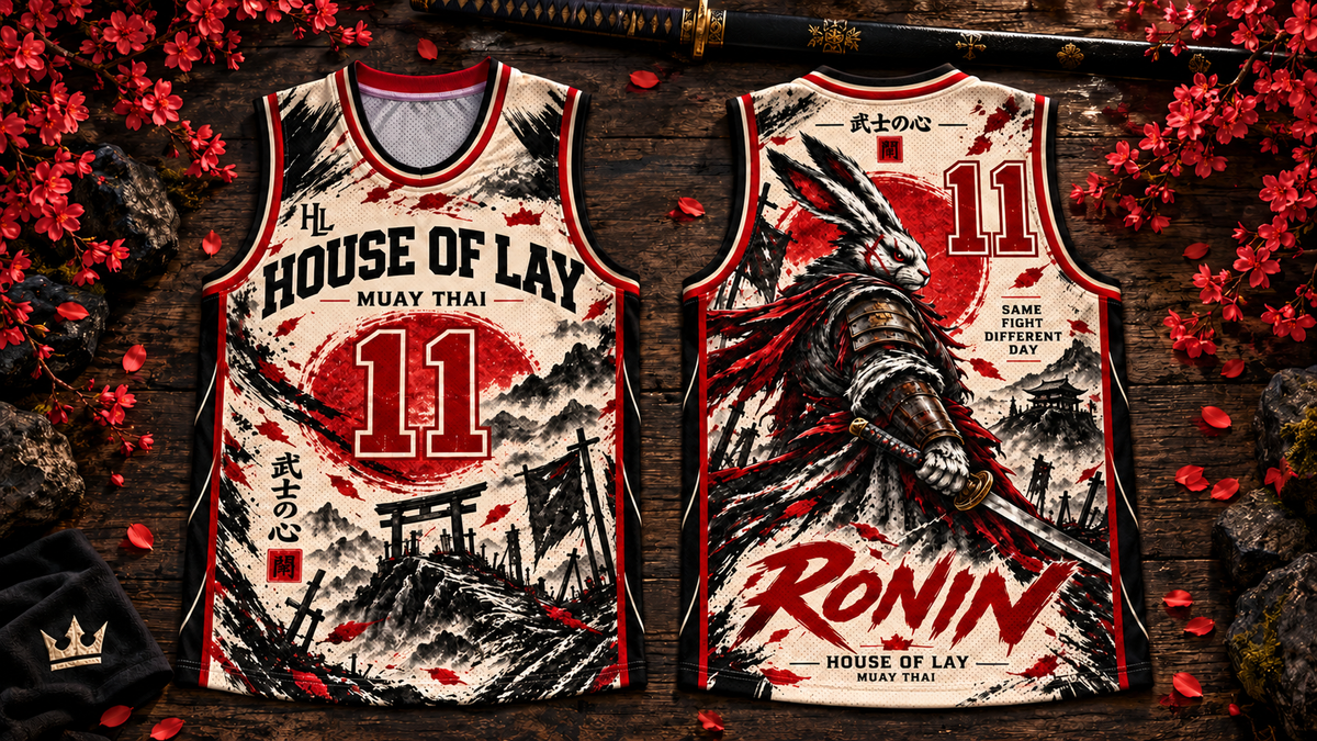 Ronin jersey design preview: cream, red and black front and back, both numbered 11, on dark wood with red blossoms.